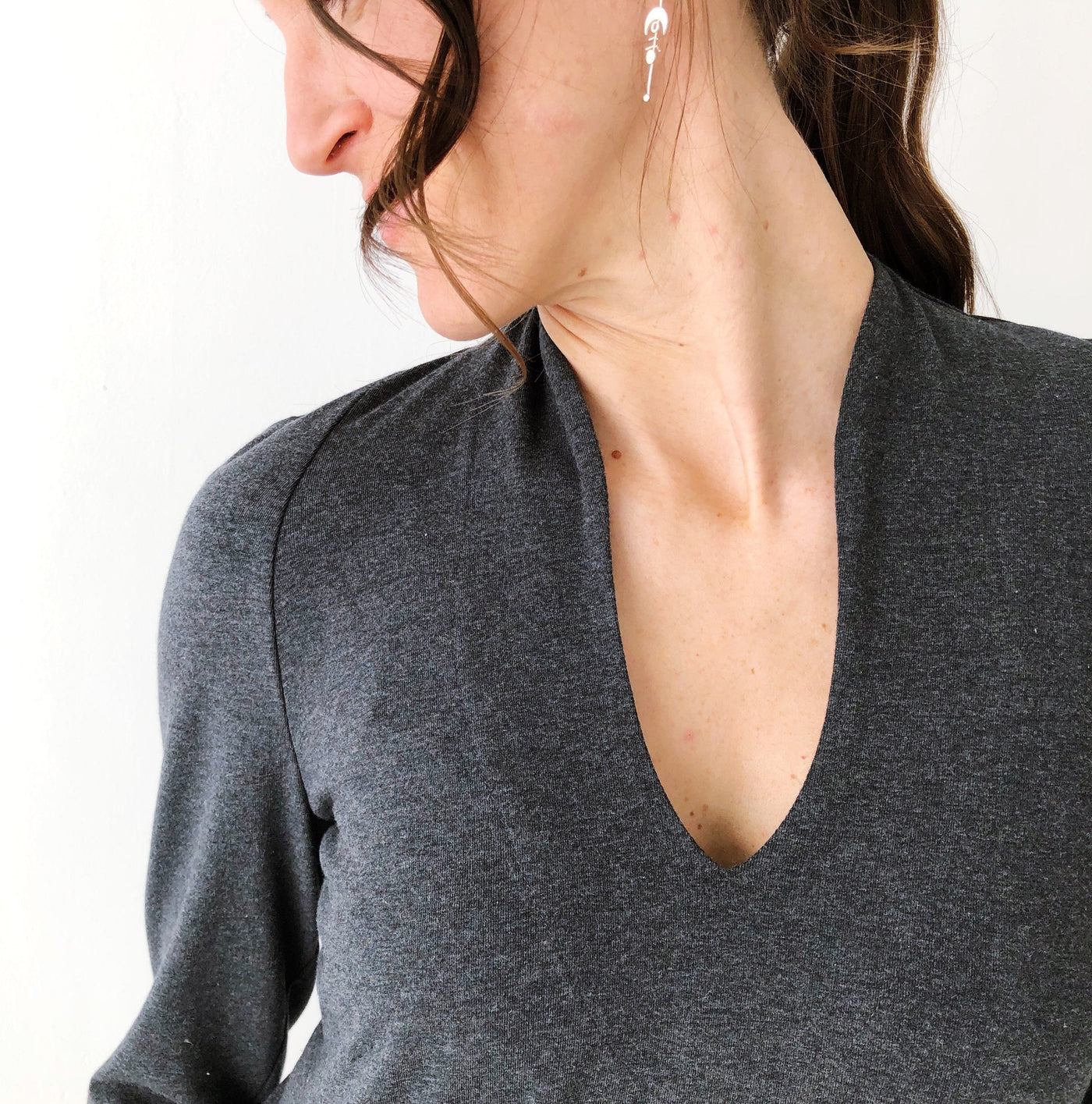 Close-up of the high curved neckline