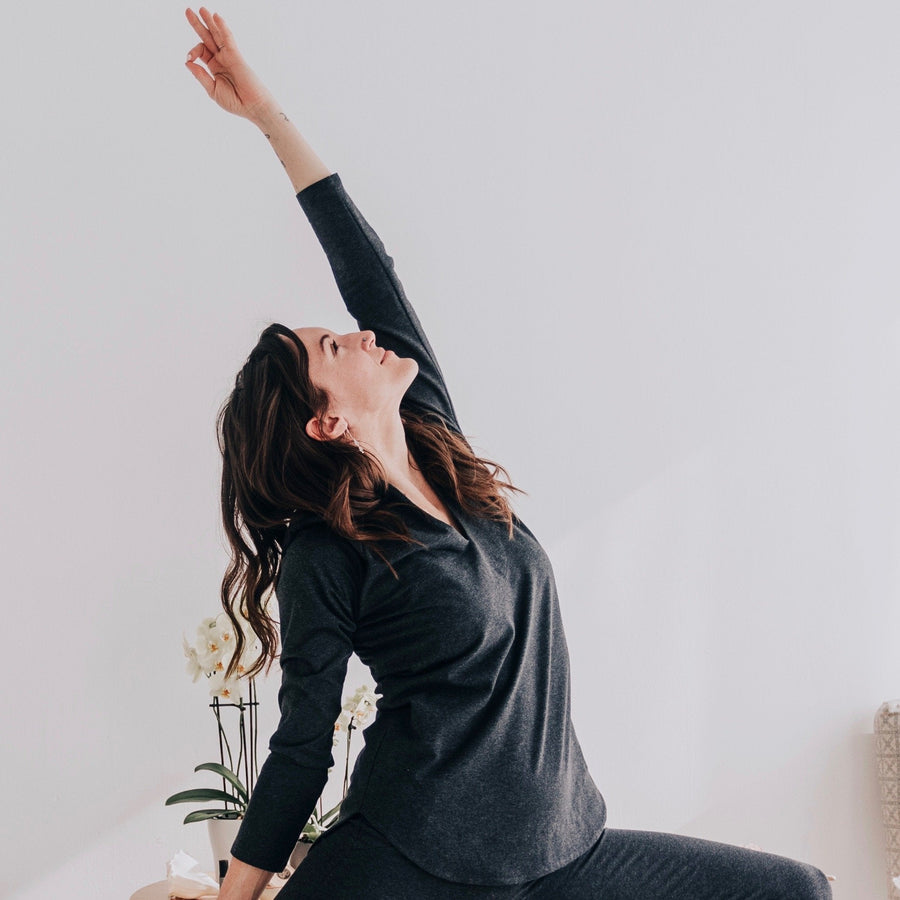 Open heart side bend in the charcoal tunic