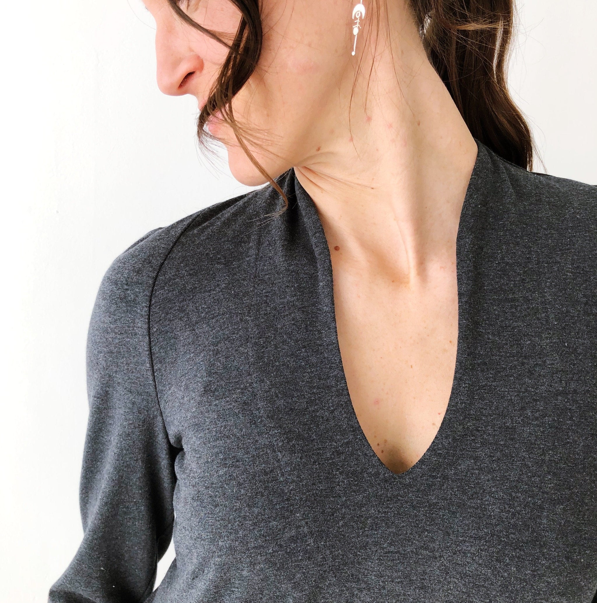 Close-up of the high curved neckline