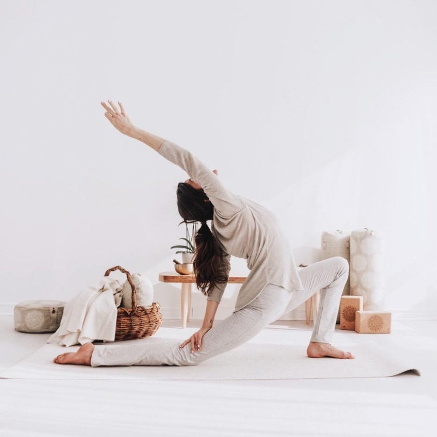 Reverse warrior in the natural hemp tunic